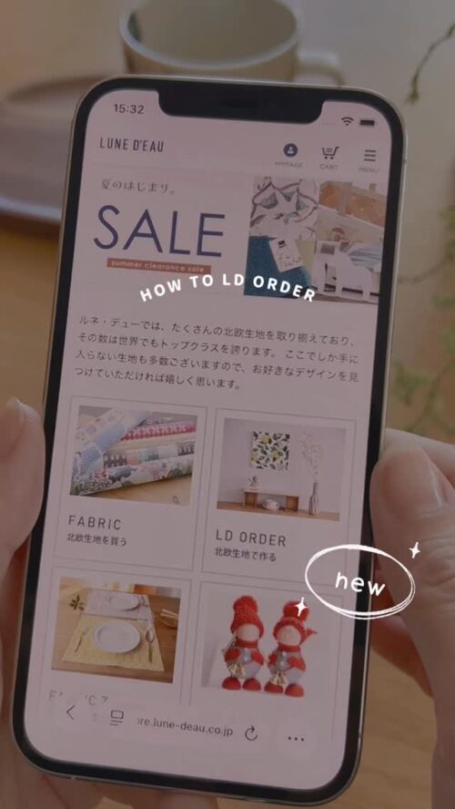 スマートフォンに表示されたルネ・デューのオンラインストア。北欧生地のFABRICとLD ORDERのメニューが並ぶ画面